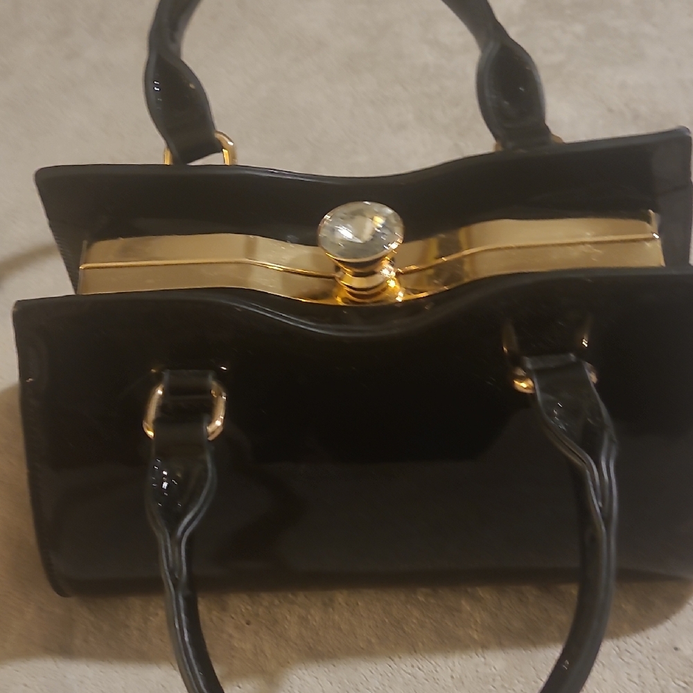 Elegant Black Handbag with Gold Accents